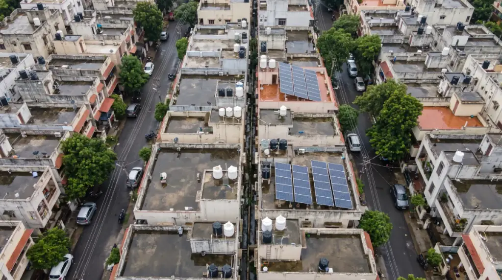 Aerial view of rooftops in Anna Nagar West with solar panels on several terraces