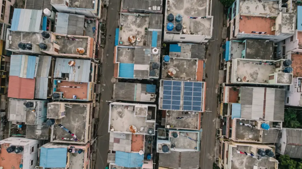 Aerial view of rooftops in Chengalpattu Town with solar panels on several terraces