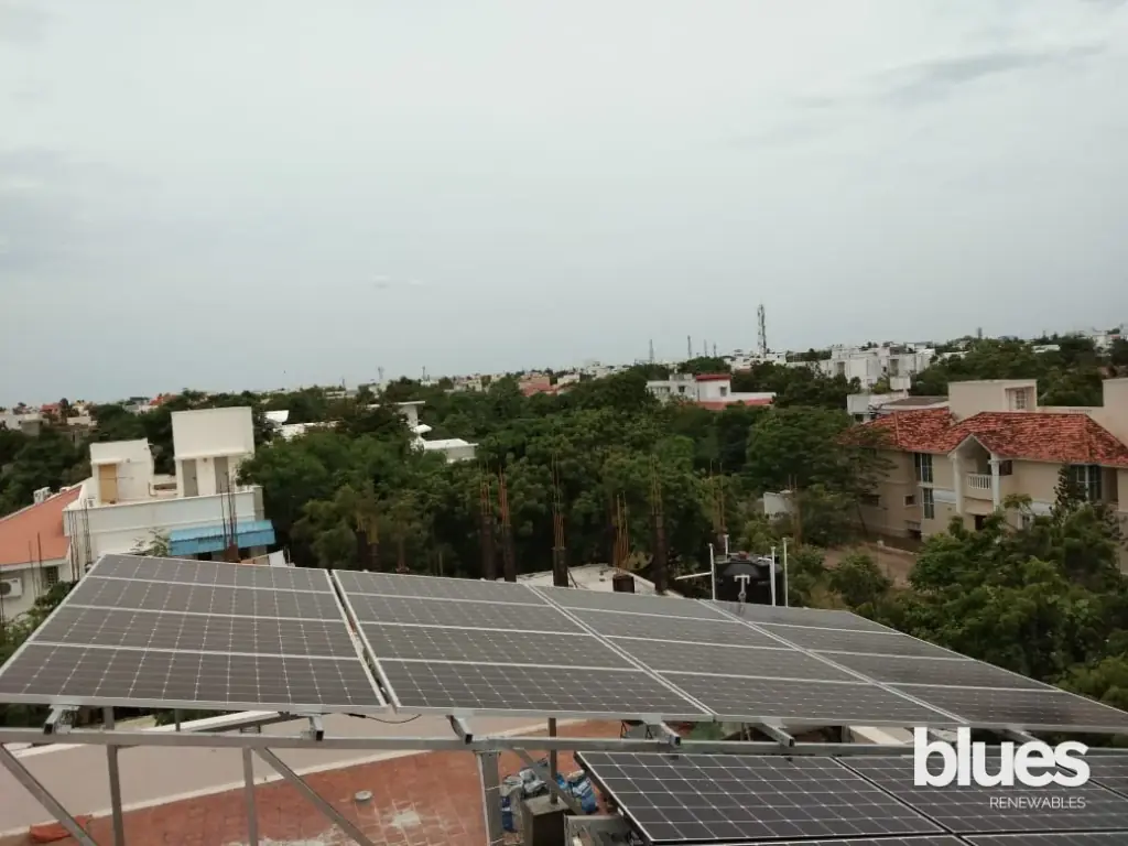 Solar panels on a farmhouse metal roof near Irungattukottai