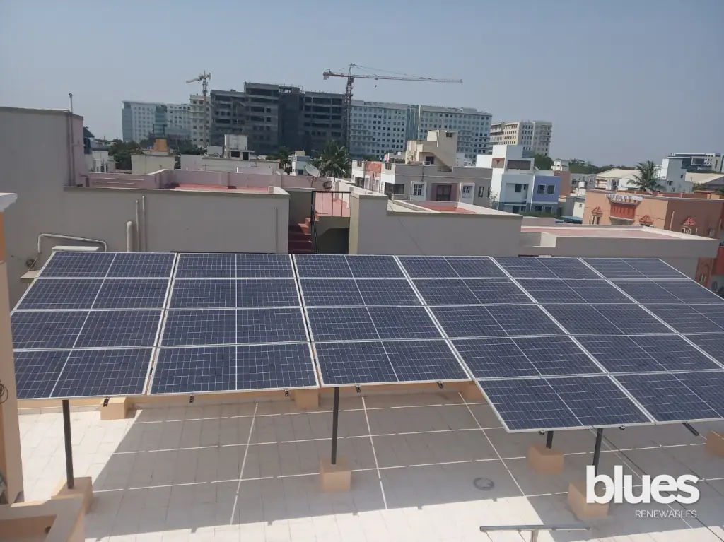 Solar panels mounted on a metal sheet roof in Medavakkam