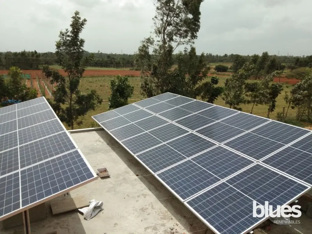 Rooftop solar panels being installed on a home terrace in Shenoy Nagar
