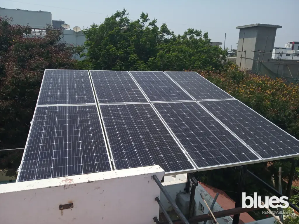 Split solar array on a red tiled terrace in Gopalapuram