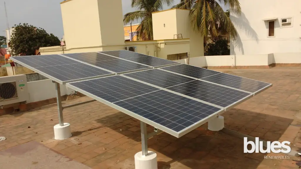 Solar panels laid on a white tiled terrace roof in Vengaivasal